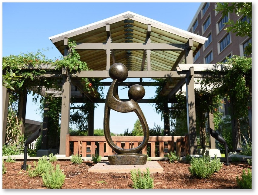 Image of Large Healers touch sculpture outside